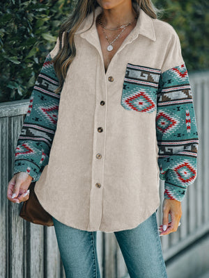 Corduroy shacket in dust storm with Aztec print sleeves and chest pocket.
