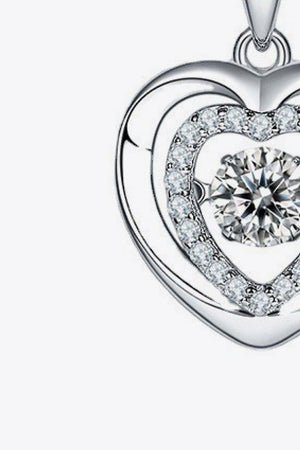 Silver heart necklace with a diamond halo and center stone