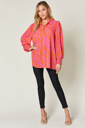 Orange and pink zebra print blouse with shirred cuffs and collar