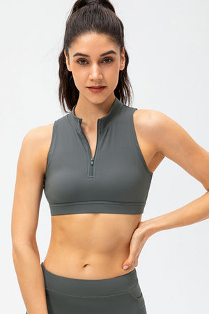 High-neck zip-front active crop top in grey, sleeveless with a cropped fit.