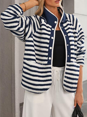 Sherpa button-up jacket with navy and white stripes, collared, and two front pockets.