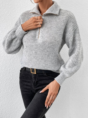 Gray ribbed knit sweater with zip-up collar and balloon sleeves