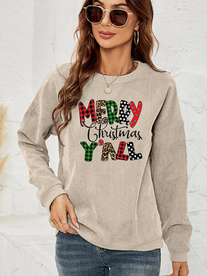 Beige corduroy sweatshirt with "Merry Christmas Y'all" graphic in plaid, leopard, and polka dot patterns.