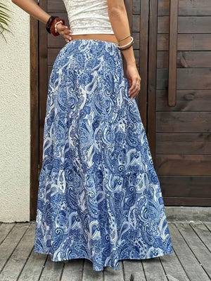 Bohemian maxi skirt in blue paisley print with tiered ruffles.
