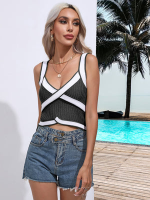 Black knit crossover tank top with white contrast trim and a plunging neckline.