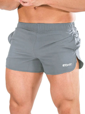 Gray athletic shorts with quick-dry fabric and a sculpted fit.