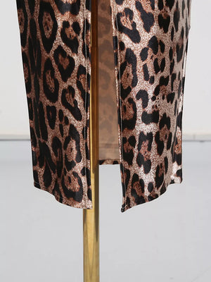 Chic leopard print bodycon midi dress with a front slit detail.