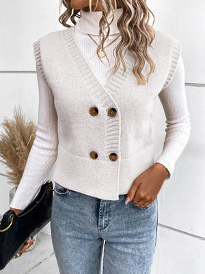White double-breasted knit vest with ribbed trim and brown buttons, V-neck.