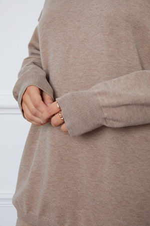 Relaxed knit polo co-ord set in Khaki, showing ribbed cuffs and neckline detail.