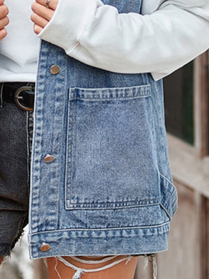 Medium wash denim hooded vest with patch pockets and button front.