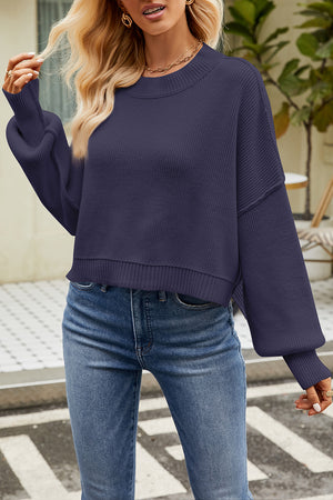 Boxy ribbed knit sweater in dark blue with crew neck and balloon sleeves.
