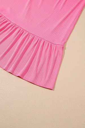Pink ribbed co-ord skirt set with a ruffled hem detail.