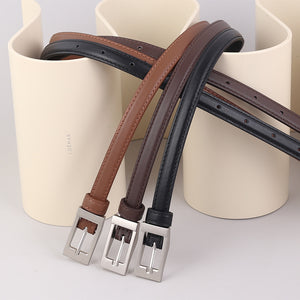 Premium cowhide leather belts in black, brown, and caramel with metal buckles.