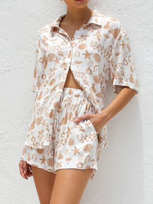 White resort set with tan beach graphic print, button-up shirt and drawstring shorts.