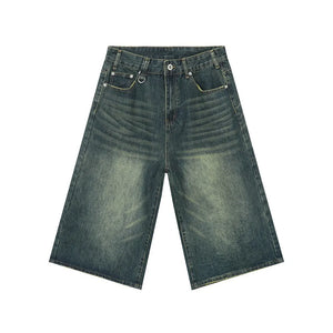 Wide-leg denim culottes in a distressed blue wash with a high waist.