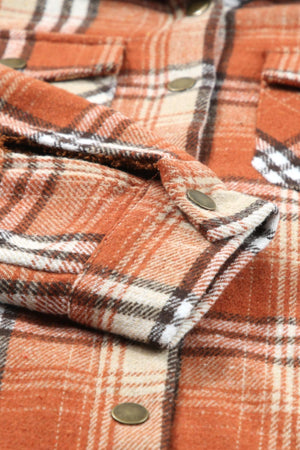 Sherpa-lined plaid overshirt jacket in tangerine with button details.