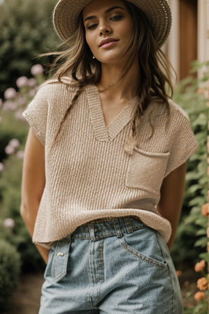 Textured knit pocket top in khaki with V-neck and short sleeves.