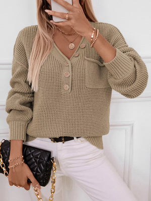 Relaxed knit sweater in olive green with button detail, V-neck, and chest pocket.