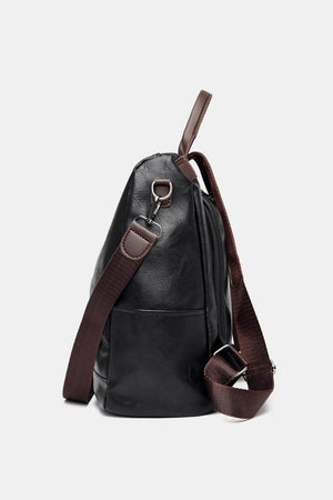 Black structured leather convertible backpack with brown strap details