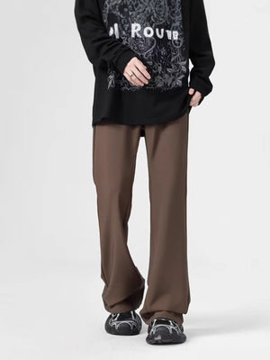 Men's relaxed fit coffee sweatpants with pockets, styled with a long sleeve graphic tee.