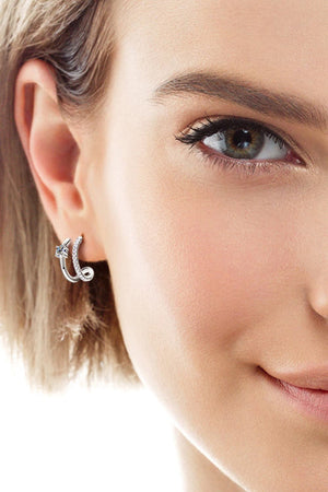Silver double-band hoop earrings with pavé and solitaire details.