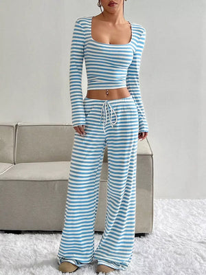 Blue and white striped knit two-piece set with a square neck crop top and wide-leg drawstring pants.