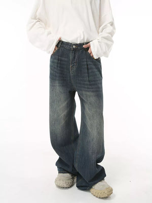 Men's dark wash wide leg denim jeans with front pleats and a relaxed fit.