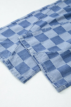 Checkerboard denim wide leg trousers in dusty blue with visible seams and hem detail.