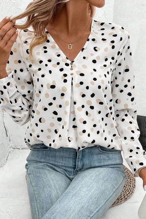 White polka dot button-down blouse with V-neck and pleats