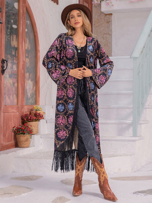 Bohemian floral duster with fringe, bell sleeves, and multicolor pattern.