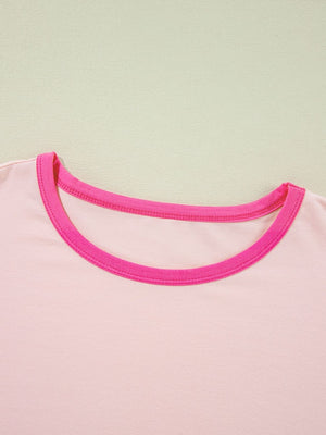 Colorblock vacay graphic tee in watermelon pink with contrast neckline trim.