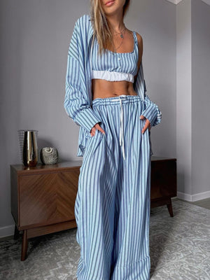 Blue striped three-piece lounge set with cami, button-up shirt, and wide-leg pants.