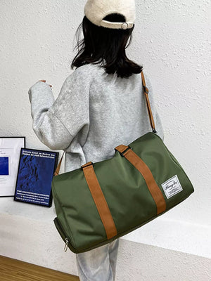 Premium Oxford cloth travel duffel bag in olive green with brown straps and a white label.
