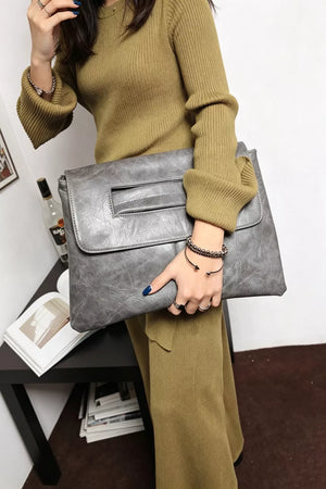 Timeless Envelope Clutch in distressed light gray leather with cut-out handle