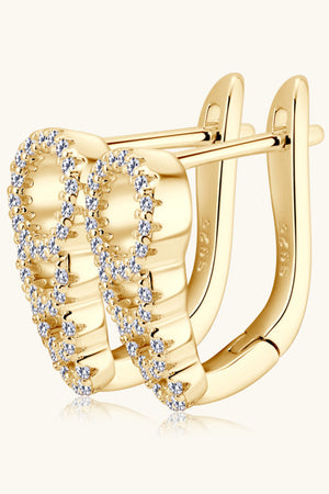 Gold pave hoop earrings with clear stones and a hinged clasp.