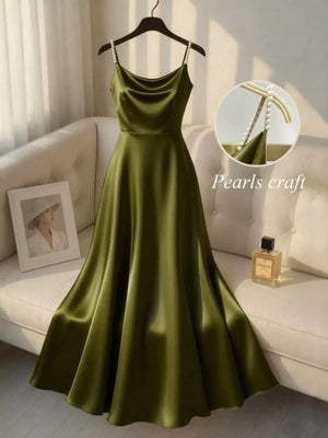 Olive green satin cami dress with pearl-embellished straps and cowl neck.