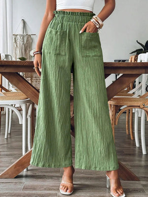 Textured wide-leg palazzo trousers in Matcha Green with elastic waist and front pockets.