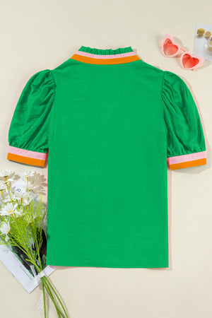 Green colorblock puff sleeve blouse with ruffled collar and contrast cuffs