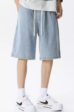 Light blue denim shorts for men with drawstring waist and relaxed fit.