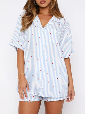 Light Blue striped pajama set with red hearts, collared button-up top and shorts.