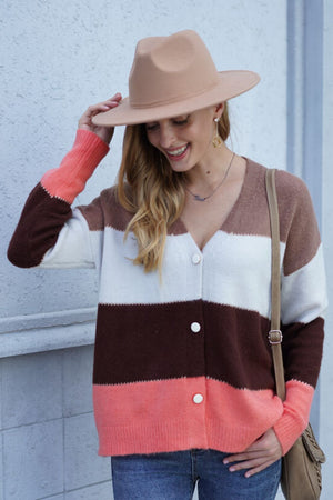 Colorblock acrylic cardigan with white, brown, and coral stripes, v-neck, button front.