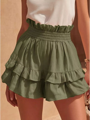 Army green ruffled high-waisted shorts with smocked waistband and tiered hem.
