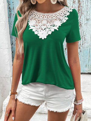 Green t-shirt with short sleeves and a white floral lace yoke detail.