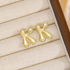 Alphabetical sculptural stud earrings in gold, Style K