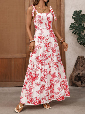 Floral tie strap maxi dress with tiered skirt and square neckline.