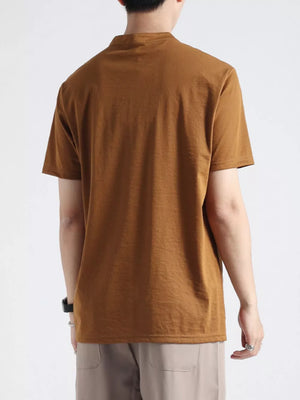Men's caramel color buttoned henley t-shirt with band collar and short sleeves.