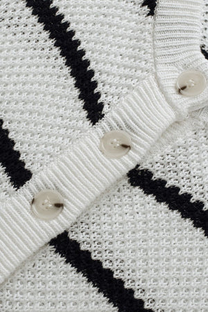 White and black stripe knit pullover sweater with button detail.