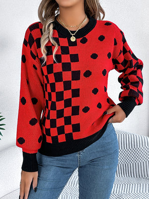 Red checkerboard & dot intarsia knit sweater with crewneck and black cuffs.