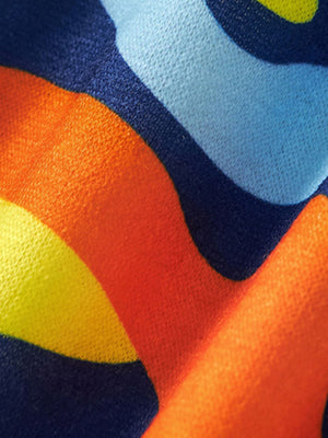 Toddler cotton t-shirt with colorful abstract wavy pattern in navy, orange, yellow, and light blue.