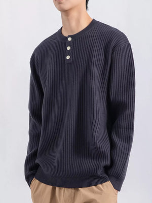 Men's dark gray ribbed knit top with three button details at the neckline.